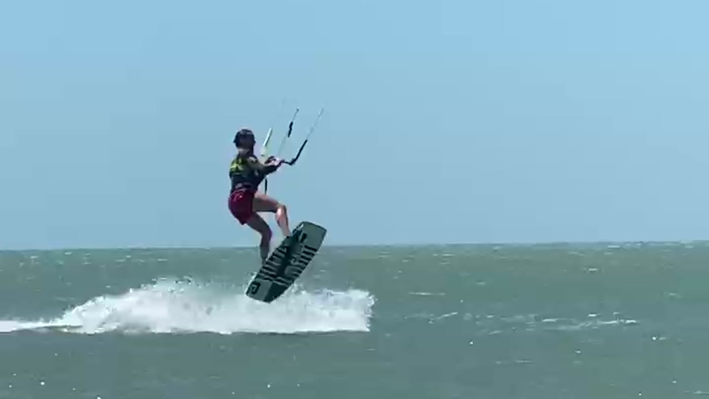 Airborne, mid-jump