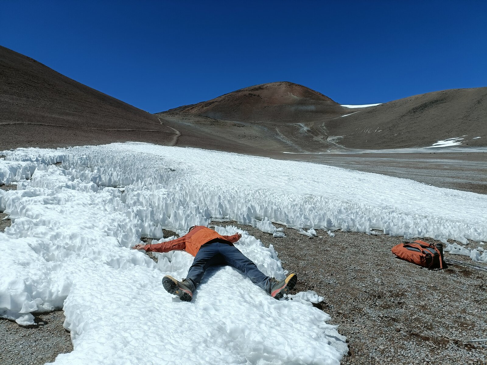 Lying flat on the ice, spent, during the first attempt